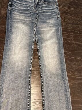 Buckle Men’s Light Blue Faded Bootcut Jeans